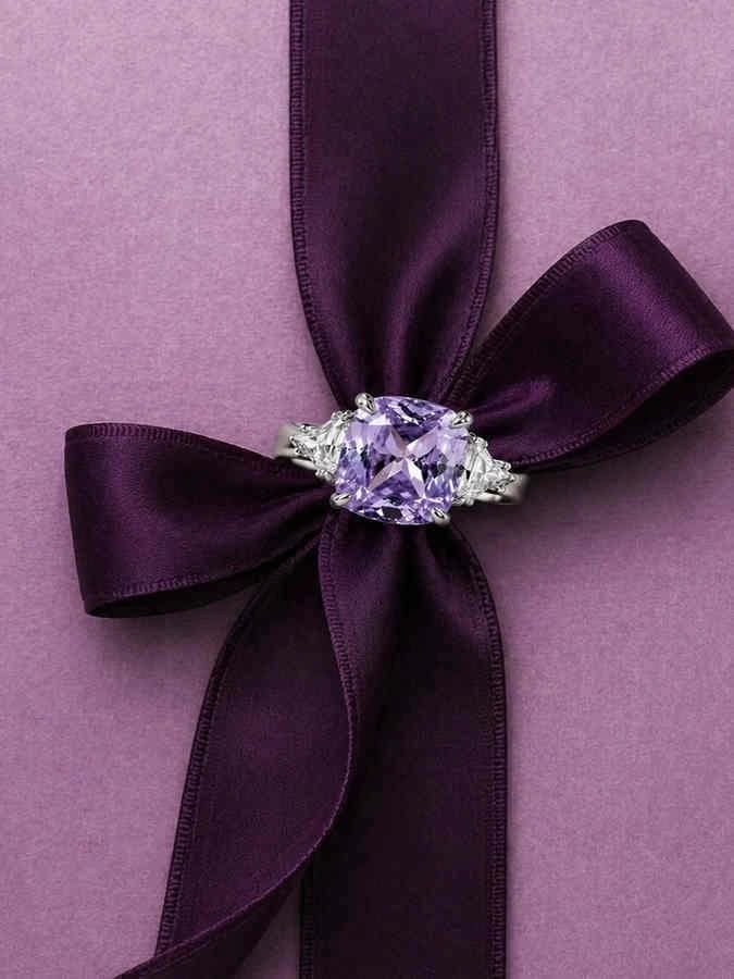 Lavender gemstone ring styled with a purple ribbon